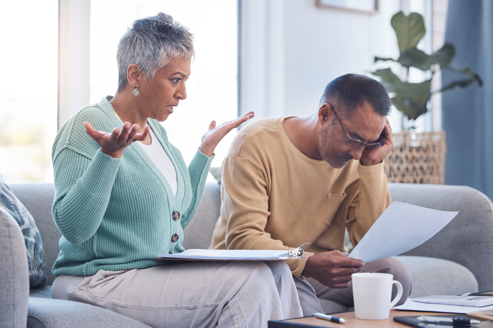 Couple discussing alimony fairness with a divorce lawyer in New Jersey.